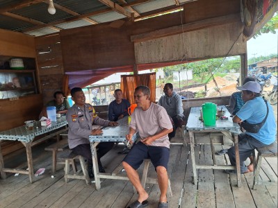 Polsek Bonai Darussalam Sampaikan Pesan Pilkada Damai di Desa Rawa Makmur